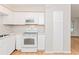White kitchen boasts modern appliances and ample storage space at 510 Brighton Way, Casselberry, FL 32707