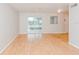 View of the light and airy living room with wood flooring and sliding glass doors at 510 Brighton Way, Casselberry, FL 32707