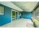 Enclosed sunroom with sliding glass doors leads to the backyard at 510 Brighton Way, Casselberry, FL 32707