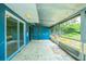 The sunroom has a screen sliding glass door, and a back door at 510 Brighton Way, Casselberry, FL 32707