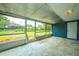 This sunroom has a screened in room, concrete floor, and an exit door at 510 Brighton Way, Casselberry, FL 32707