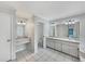 Bathroom with dual sinks, vanities, and tile flooring at 5212 Waterwood Run, Bartow, FL 33830