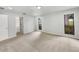 Carpeted bedroom with neutral paint, windows, and door to bathroom at 5212 Waterwood Run, Bartow, FL 33830