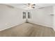 This is a view of the empty bedroom featuring neutral carpet, modern fan, and natural lighting at 5212 Waterwood Run, Bartow, FL 33830