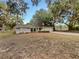 Charming single-story home with lush landscaping and mature trees at 5212 Waterwood Run, Bartow, FL 33830