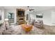 Inviting living room features a brick fireplace, plush seating, and a cozy rug at 5212 Waterwood Run, Bartow, FL 33830