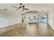 Spacious living area with view of the kitchen and screened-in patio at 5212 Waterwood Run, Bartow, FL 33830