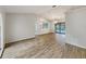 Bright living room featuring hardwood floors, neutral walls, and a view of the pool at 5212 Waterwood Run, Bartow, FL 33830