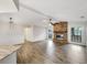 Open-concept living area with fireplace and hardwood flooring at 5212 Waterwood Run, Bartow, FL 33830