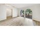 Inviting living room with unique arch windows and neutral paint at 5212 Waterwood Run, Bartow, FL 33830