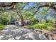 Charming one-story home with a well-maintained lawn, inviting curb appeal, and a spacious driveway leading to an attached garage at 5301 Forest Breeze Ct, St Cloud, FL 34771