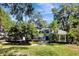 Well-maintained home with a manicured lawn, mature landscaping, and inviting front entrance, creating a warm welcome at 5301 Forest Breeze Ct, St Cloud, FL 34771