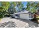 Well-maintained home featuring a two-car garage and a long driveway, providing ample parking space for residents and guests at 5301 Forest Breeze Ct, St Cloud, FL 34771