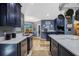Bright, spacious kitchen with a large island, stainless steel appliances, and bar with beverage fridge at 5301 Forest Breeze Ct, St Cloud, FL 34771