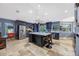 Lovely kitchen featuring custom cabinets, a large island, stainless steel appliances, and eat in breakfast bar at 5301 Forest Breeze Ct, St Cloud, FL 34771