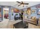 Living Room featuring carpet floors, ceiling fan, and an adjacent bedroom at 5301 Forest Breeze Ct, St Cloud, FL 34771