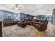 Open-concept living area with comfortable seating, stylish decor, and a seamless flow to the kitchen and dining areas at 5301 Forest Breeze Ct, St Cloud, FL 34771