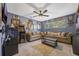 Living Room featuring carpet floors, ceiling fan, and an arcade machine at 5301 Forest Breeze Ct, St Cloud, FL 34771