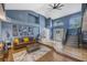 Spacious living room with a cozy leather sofa, stylish decor, and plenty of natural light streaming through the windows at 5301 Forest Breeze Ct, St Cloud, FL 34771