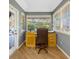 Bright home office featuring wood floors, ample natural light, and a view of the outdoors at 5301 Forest Breeze Ct, St Cloud, FL 34771