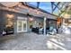 Relaxing covered patio with ceiling fans, lights, neutral colors and ample seating space at 5301 Forest Breeze Ct, St Cloud, FL 34771