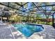 Inviting screened-in pool with lush landscaping creating a private and relaxing outdoor space, with comfortable patio at 5301 Forest Breeze Ct, St Cloud, FL 34771