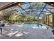 Gorgeous screened-in pool with lush landscaping, offering a serene backyard oasis and shaded relaxation at 5301 Forest Breeze Ct, St Cloud, FL 34771
