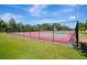 Well-maintained community tennis courts surrounded by lush greenery, providing residents with recreational opportunities and a healthy lifestyle at 5301 Forest Breeze Ct, St Cloud, FL 34771