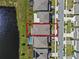 Aerial view showcasing the home's location and spacious backyard with a red outline at 5648 Cedar Chase Dr, St Cloud, FL 34771