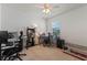 Bedroom showcasing functional layout as a home office with dual desks, shelves, and comfortable seating at 5648 Cedar Chase Dr, St Cloud, FL 34771