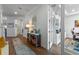 Hallway leads to a well-lit office space and features modern decor at 5648 Cedar Chase Dr, St Cloud, FL 34771