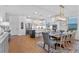 Bright, modern kitchen featuring stainless steel appliances, a kitchen island, and an adjacent dining area at 5648 Cedar Chase Dr, St Cloud, FL 34771