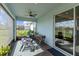 Relaxing screened-in patio with comfortable seating and sliding glass doors to the interior at 5648 Cedar Chase Dr, St Cloud, FL 34771