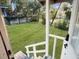 View of a large back yard from a house's back porch, showing the grass and fence at 609 W Osceola St, Clermont, FL 34711