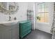 Bathroom features a stylish vanity, a decorative mirror, and plenty of storage space at 609 W Osceola St, Clermont, FL 34711