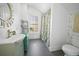 Bathroom features a unique vanity, modern fixtures, and plenty of natural light from the window at 609 W Osceola St, Clermont, FL 34711