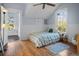 Bright bedroom with wood floors, natural light, and cozy decor, offering a comfortable and inviting atmosphere at 609 W Osceola St, Clermont, FL 34711