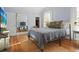 Well-lit bedroom with hardwood floors, a large mirror, and comfortable furnishings, creating a welcoming space at 609 W Osceola St, Clermont, FL 34711