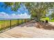 Picturesque boardwalk with lake views, lush greenery, and benches for relaxation at 609 W Osceola St, Clermont, FL 34711