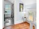 Inviting hallway leads to a charming bathroom, with unique decor and ample natural light at 609 W Osceola St, Clermont, FL 34711