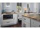 Spacious kitchen with white cabinets, butcher block countertops, and open shelving at 609 W Osceola St, Clermont, FL 34711