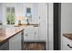 Charming kitchen features white cabinets, butcher block countertops, and stainless steel appliances at 609 W Osceola St, Clermont, FL 34711