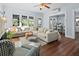 Spacious living room features hardwood floors, stylish furniture, and natural light at 609 W Osceola St, Clermont, FL 34711