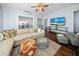 Cozy living room with hardwood floors, stylish furniture, and a ceiling fan at 609 W Osceola St, Clermont, FL 34711
