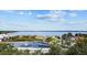 Picturesque water feature with a central fountain, a pier, and lush landscaping, providing a serene park view at 609 W Osceola St, Clermont, FL 34711
