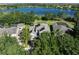 Aerial view of property with solar panels overlooking a tranquil lake at 6152 Meriwether, Winter Garden, FL 34787