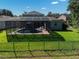 Enjoy this backyard oasis, featuring a screened-in pool, lush greenery, and ample space for relaxation and outdoor entertaining at 6152 Meriwether, Winter Garden, FL 34787