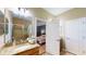 Bright bathroom featuring a granite vanity and glass enclosed tiled shower at 6152 Meriwether, Winter Garden, FL 34787