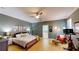 Relaxing main bedroom boasts a ceiling fan and ensuite bathroom access at 6152 Meriwether, Winter Garden, FL 34787
