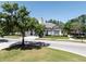 Clubhouse exterior featuring manicured landscaping and a charming copper-topped cupola at 6152 Meriwether, Winter Garden, FL 34787